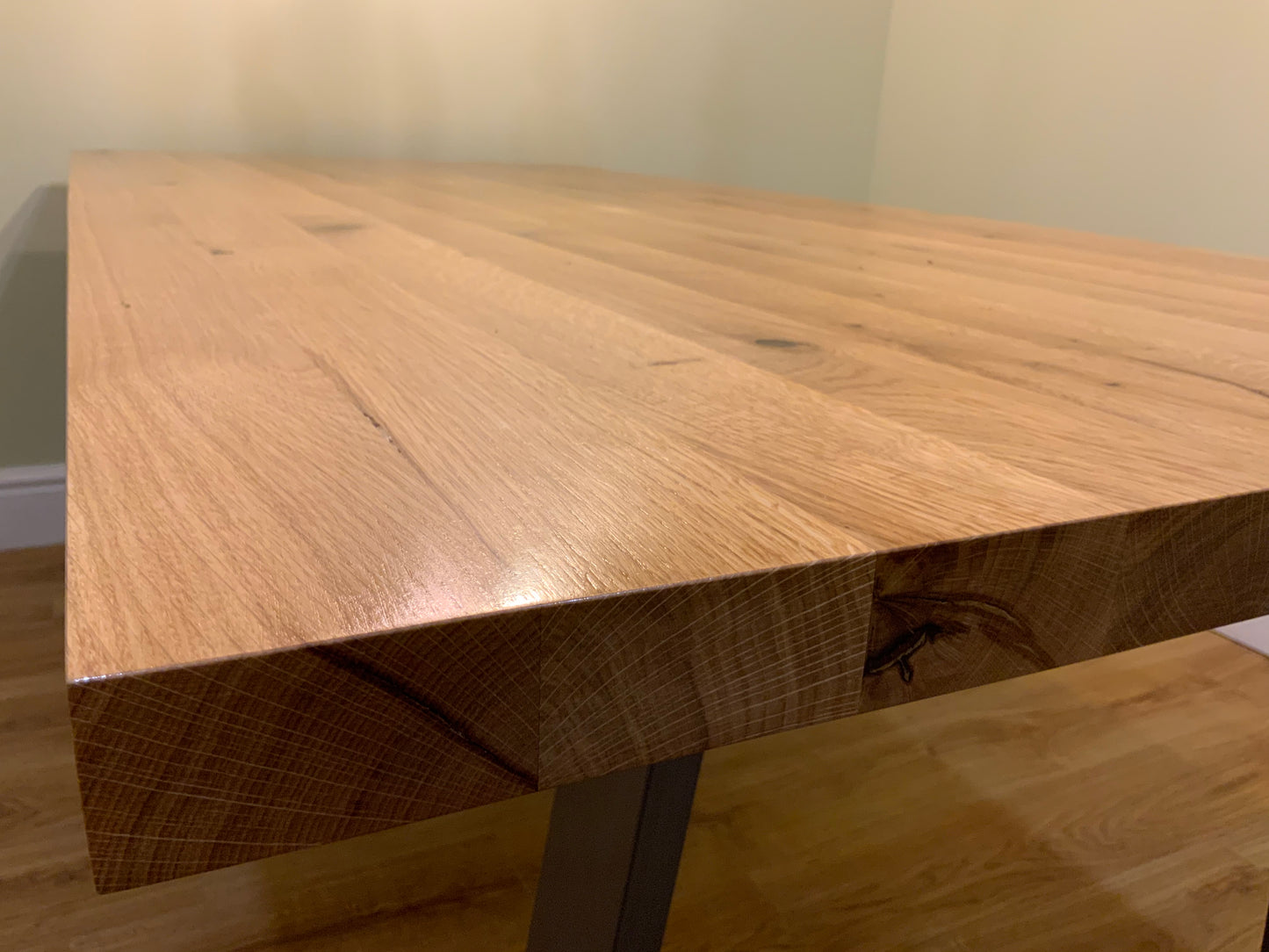 Solid oak dining table with industrial metal legs